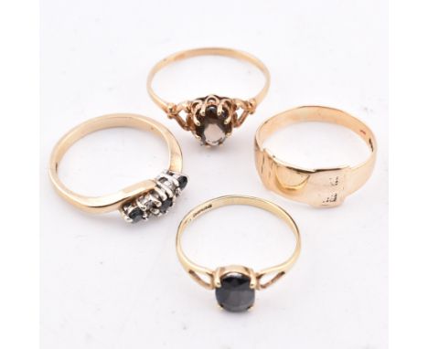Four hallmarked 9ct gold rings. The four rings to include a hallmarked 9ct gold sapphire and diamond crossover ring, hallmark