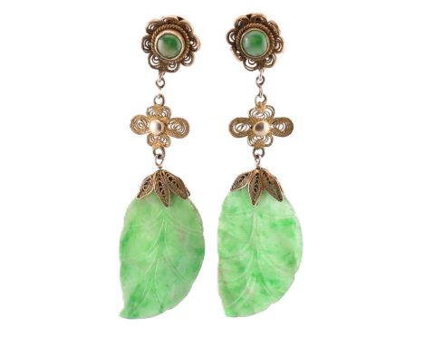 A pair of silver and jade pendant earrings. The earrings having a jade pendant in the form of a leaf surmounted by metal fili