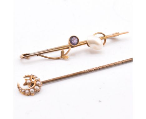 A hallmarked 9ct gold and gem set brooch pin and a gold and seed pearl stick pin. The lot to include a 9ct gold brooch pin se