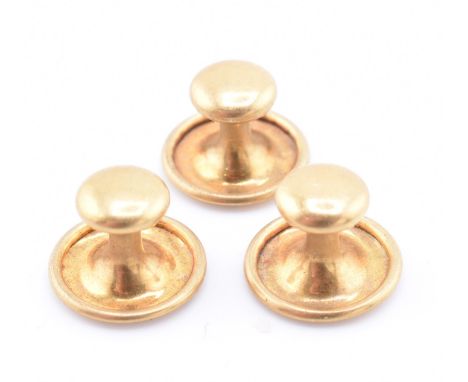 Three 18ct gold button studs. All stamped 18ct. Total weight 2.23g. All weights, measurements and sizes are approximate. 