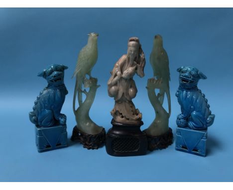 A pair of jade carved exotic birds, a carved soapstone figure and a pair of lions
