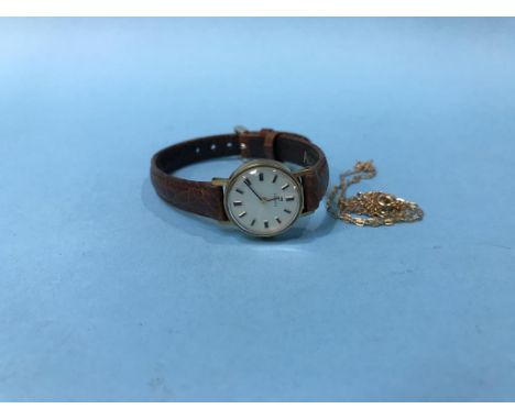 A 9ct Tissot watch and a 9ct chain
