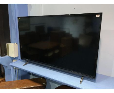 A Hitachi Television, with remote