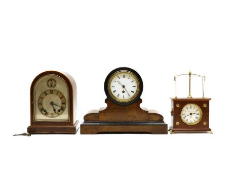 A group of three mantel clocks,comprising a domed mahogany clock, with a two-train movement, 25.5cm high, a walnut mantel clo