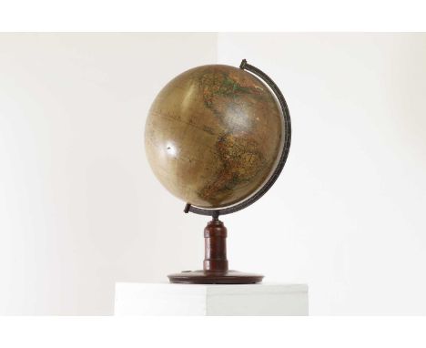 A twelve-inch terrestrial globe by Kosmos, Stuttgart, first half of the 20th century, German, inscribed 'Wirtschaftspolitisch