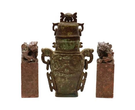 A pair of Chinese soapstone seals,Republic period (1912-1949), of rectangular form, each mounted by a Buddhist lion with a pu