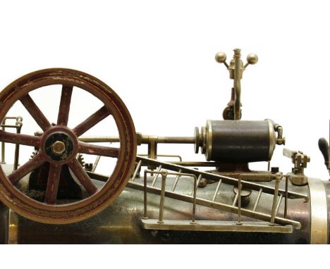A stationary steam engine,early 20th century, with boiler, whistle, sight glass and other expected fittings, raised on cast m