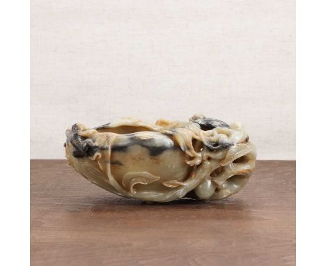A Chinese jade brush washer,20th century, in the shape of a peach with monkeys perched on the stem,19cm longCondition ReportC