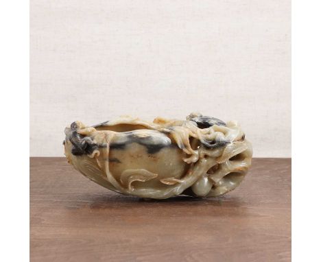 A Chinese jade brush washer,20th century, in the shape of a peach with monkeys perched on the stem,19cm longCondition ReportC