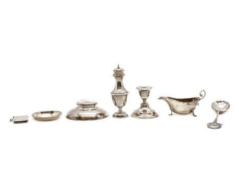 A collection of silver items,comprising a silver sauceboat, Birmingham 1932, 13.9cm long, a serving spoon, by James Dixon &am