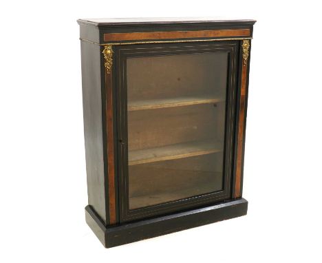 A Victorian ebonised pier cabinet,with inlaid walnut banding and gilt metal mounts, on a plinth base,77cm wide29cm deep99cm h