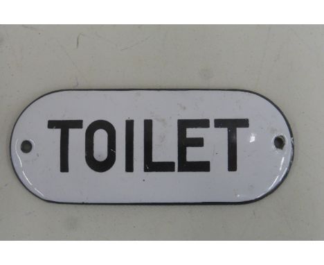 A domed enamel door plate sign for Toilet, 4 x 1 3/4".