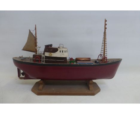 A scale model of a tug boat.