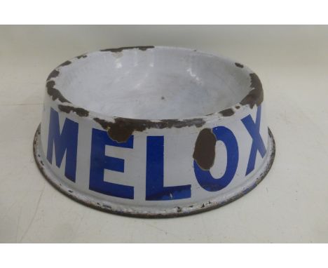 A Melox enamel dog bowl with a repair and restoration to the base of the bowl.