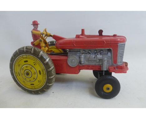 A part tinplate tractor, possibly Marx.