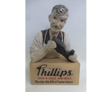 A Phillips Stick-a-Soles and Heels shop window advertising figure. 