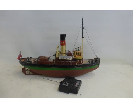 A remote controlled scale model of a boat.