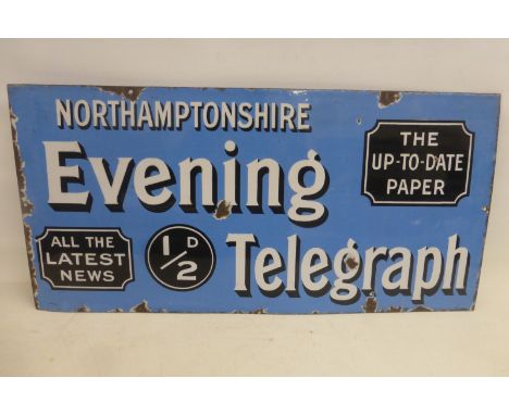 A Northamptonshire Evening Telegraph rectangular enamel sign with good gloss, 30 x 14 3/4". 