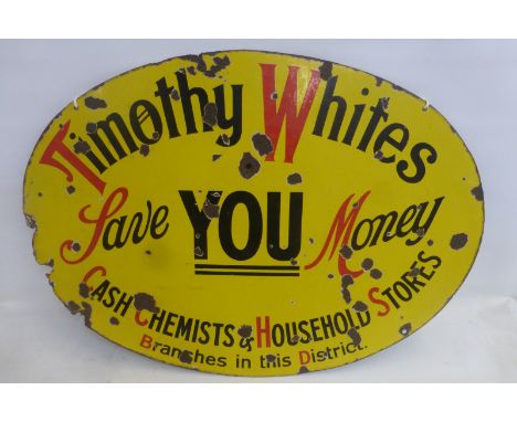 A Timothy Whites 'Save you money' oval enamel sign, 35 1/2 x 25".