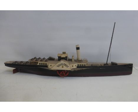 A scale model of a paddle steamer.