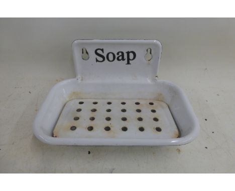 An enamel wall hanging soap dish.