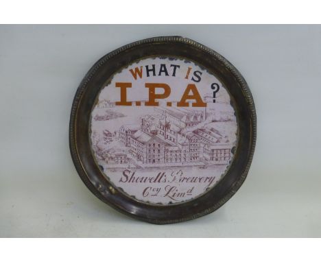 A rare I.P.A. Showell's Brewery Company Limited pictorial enamel tray with brass border, depicting the factory, titled 'What 