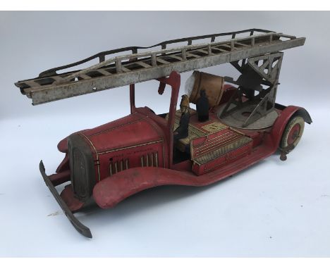 A clockwork tinplate model of a fire engine, possibly Mettoy.