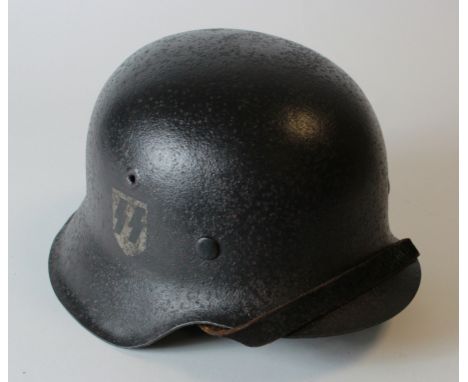 German WW2 raw edge combat helmet badged to the SS complete with liner & chin strap, light old corrosion overall.