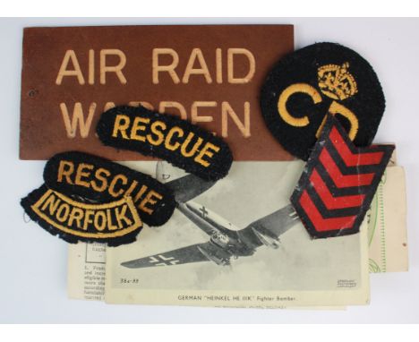 Cloth Badges: 1) CD with Crown over 'Civil Defence'.  2) 2x 'Rescue' Shoulder Badge. 3) Red Service Chevrons. 4) Shoulder Bad