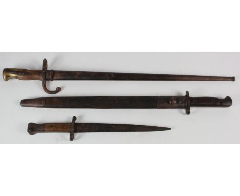 Bayonets inc Wilkinson 07 pattern, unit marked 'T 317 RE AA 60'. Plus a French Epee bayonet, these both with scabbards, plus 