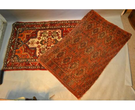 A North West Persian Woollen Rug With A Central Medallion within an all over design upon a cream, blue and red ground, togeth