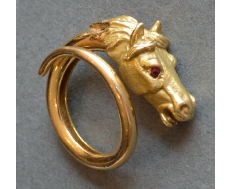 An 18ct. Gold Heavy Ring In The Form Of A Horses Head, the eyes set with rubies, 11.9g 