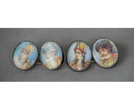A pair of 19th century unmarked white metal cufflinks
Each painted with an Indian miniature portrait.  Each 1.3 cm high. COND