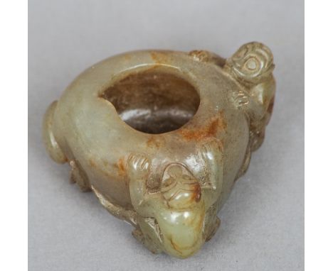 A Chinese carved russet jade brush washer
Modelled as a peach and two monkeys.  5.5 cm wide. CONDITION REPORTS: Generally in 