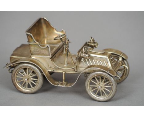 A silver novelty desk stand, hallmarked London 1923, maker's mark of Albert Clarke
Modelled as a vintage car, possibly a 1902