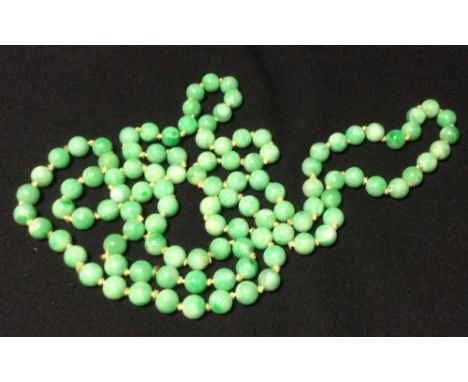 A string of 108 carved jade Buddhist prayer beads
122 cm long overall. CONDITION REPORTS: Generally in good condition, expect