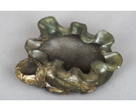 A Chinese carved spinach jade brush washer
Worked as a flowering fruit.  9 cms wide. CONDITION REPORTS: Generally in good con