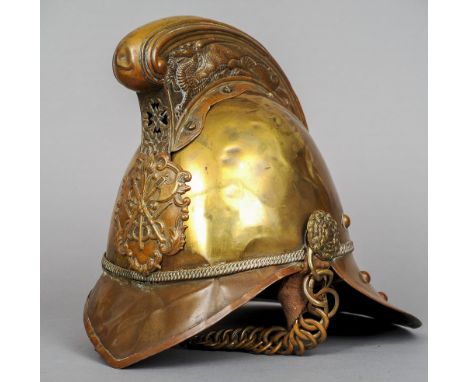 A brass Merryweather pattern fireman's helmet 
With dragon comb and crossed axe and hose badge. CONDITION REPORTS: Generally 