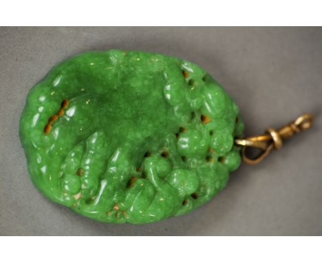 A carved jade pendant
Worked with monkeys.  5 cm long. CONDITION REPORTS: Generally in good condition, expected wear, approxi