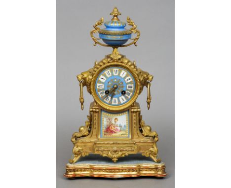 A 19th century gilt metal and Sevres type panel inset mantel clock
The blue enamelled dial with Roman numerals and bell strik