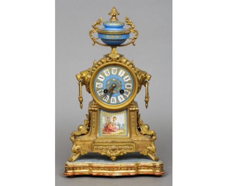 A 19th century gilt metal and Sevres type panel inset mantel clock
The blue enamelled dial with Roman numerals and bell strik