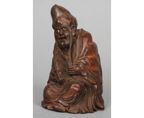 A Chinese carved bamboo figure of a sage
Modelled seated, holding a scroll.  16.5 cm high. CONDITION REPORTS: Generally in go