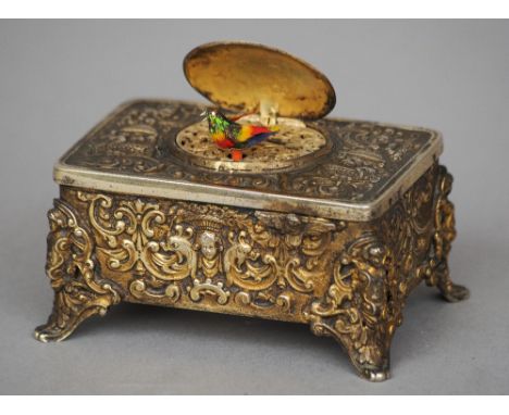 A gilt metal cased bird automaton
The case C-scroll cast, the movement clockwork.  11 cm wide. CONDITION REPORTS: Generally i