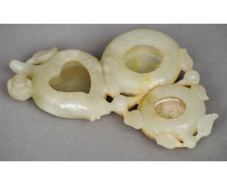 A Chinese carved russet jade triple brush washer
Worked as flowering fruits.  13 cm wide. CONDITION REPORTS: Generally in goo