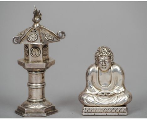 An early 20th century Chinese silver pepperette formed as Buddha
Typically modelled seated; together with another Chinese sil