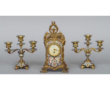 A French champleve and gilt metal triple clock garniture
The timepiece with floral painted dial with retailers mark for Henri