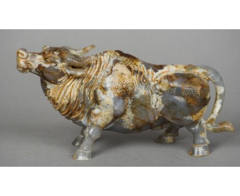 A large Chinese carved russet jade model of a bull
Naturalistically modelled.  22.5 cm long. CONDITION REPORTS: Generally in 