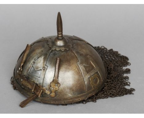 An Indo-Persian Kulah-khud helmet 
Of typical form with spike, chainmail and applied Katar decoration.  CONDITION REPORTS: Ge