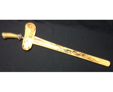 An Indonesian kris and scabbard
The shaped blade with damasked decoration, the hilt with gem set collar.  68 cm long overall.