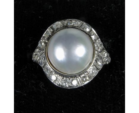 An Art Deco pearl and diamond set platinum target ring
In fitted case. CONDITION REPORTS: Generally in good condition, expect